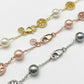 Detailed shot of the secure lobster clasp and the signature Double T logo charm on the pearl bracelet