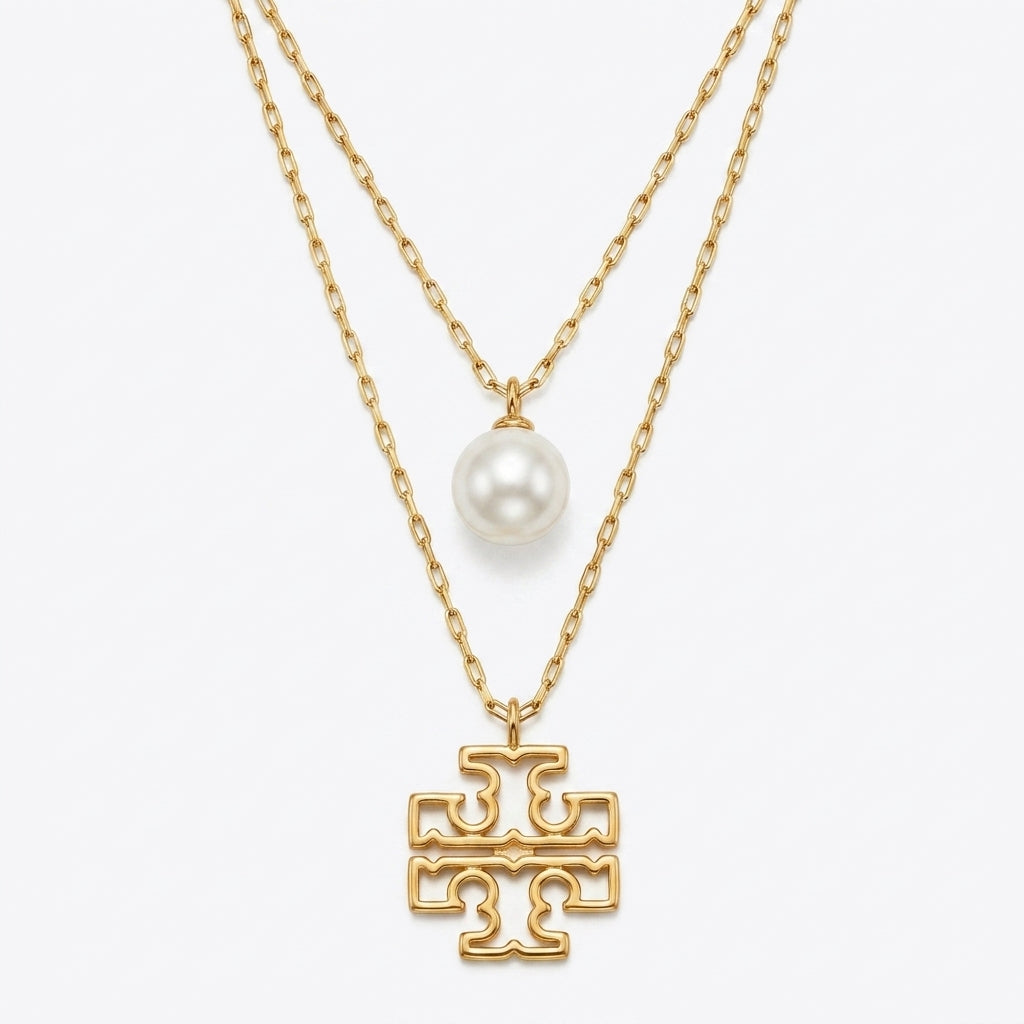 Tory Burch Britten Double Strand Necklace in 18k gold-plated finish with layered chains and logo
