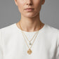 Model wearing Tory Burch Britten Double Strand Necklace, an elegant statement piece for modern styling