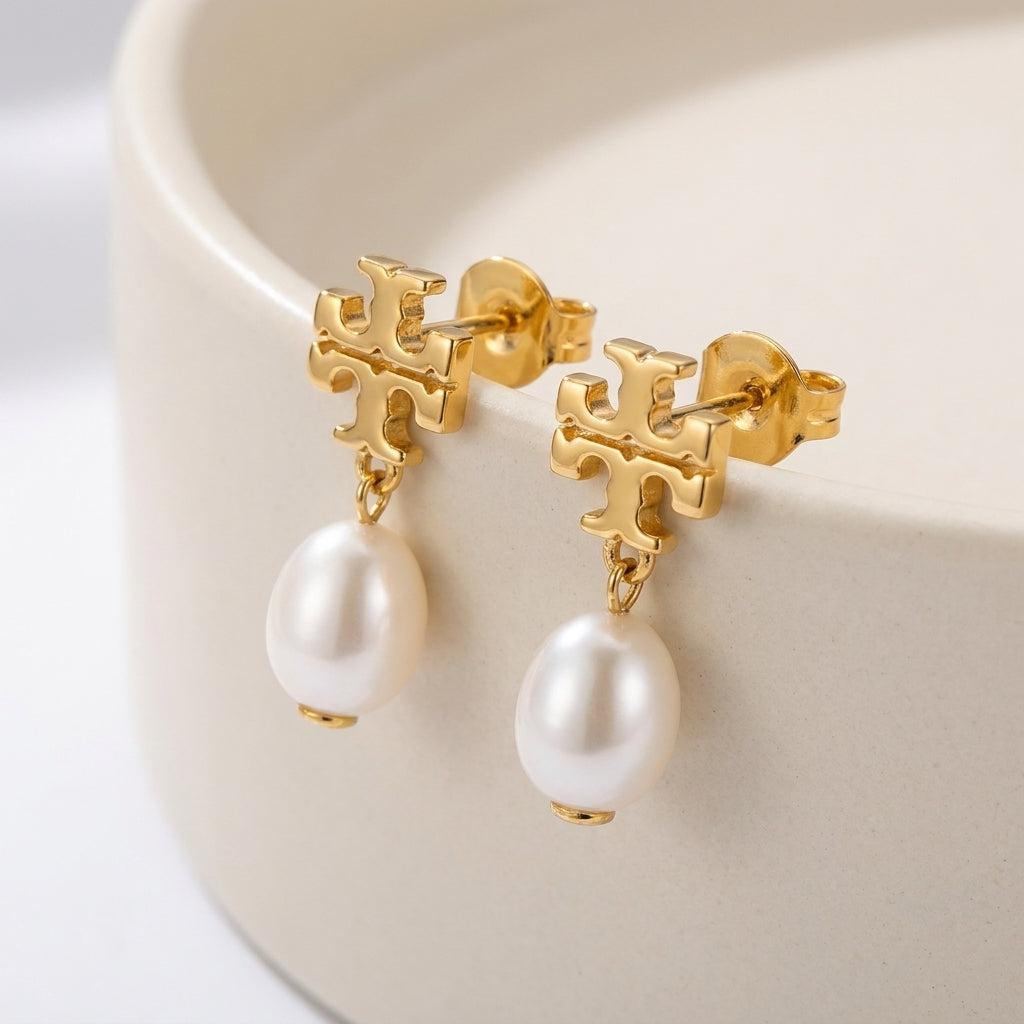Macro detail of the lustrous pearl and the intricate crystal setting on Moondance celestial earrings