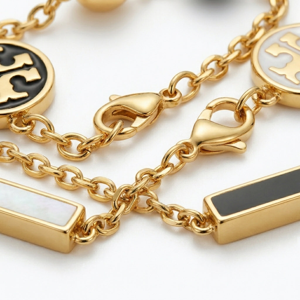 Detailed view of the secure lobster clasp and the adjustable extender on the gold pearl bracelet