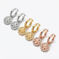 Angled profile of Tory Burch Crystal Hoops highlighting the 360-degree sparkle and hinge design