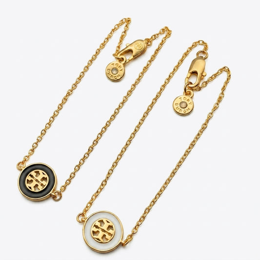 Tory Burch Double T Logo Pendant Necklace in polished 18k gold-plated finish, a timeless simple gold accessory