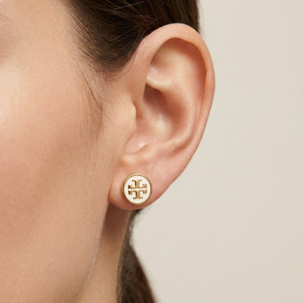 Model wearing Tory Burch Colorful Enamel Circle Earrings, perfect for adding a pop of color to any outfit