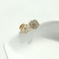 Side view of the Tory Burch Forget Me Not floral stud earrings showing the intricate white enamel petals and gold-tone finish.