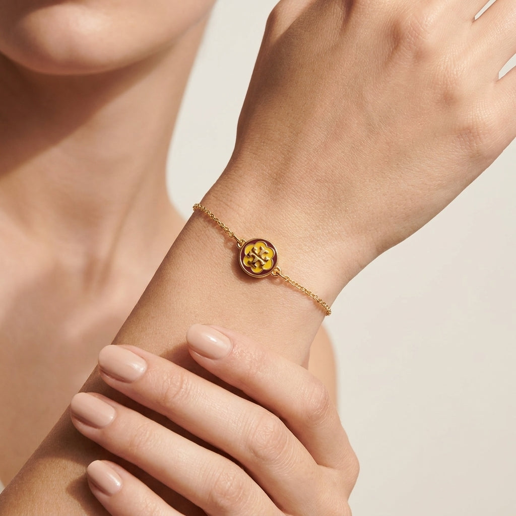 Model wearing Tory Burch Kira Flower Bracelet, an elegant feminine accessory for daily wear