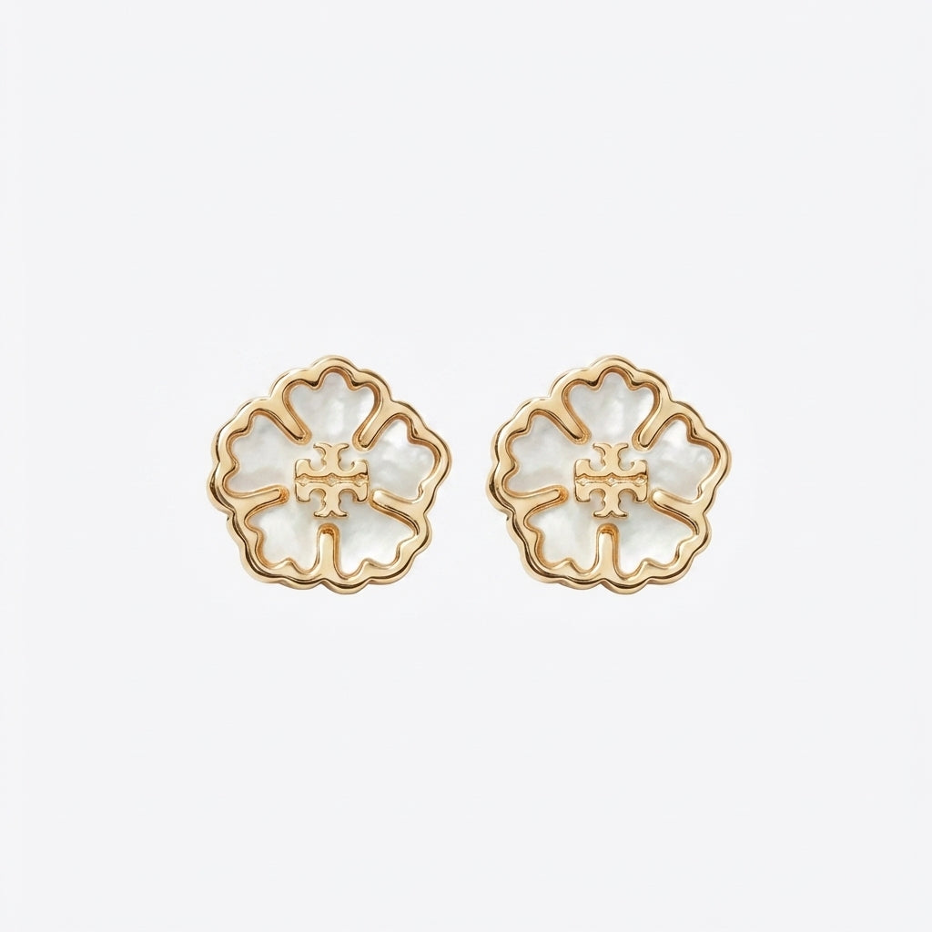 Tory Burch Forget Me Not Earrings featuring a gold floral design with the signature Double-T logo in the center.