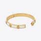 Tory Burch Gold and White Bangle Bracelet in 18k gold-plated finish with ivory enamel inlay