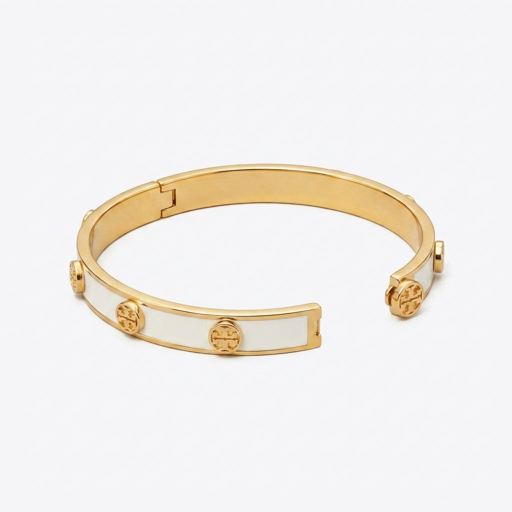 Tory Burch Gold and White Bangle Bracelet in 18k gold-plated finish with ivory enamel inlay