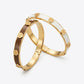 Tory Burch Gold and White Bangle Bracelet featuring 18k gold-plated brass and ivory enamel