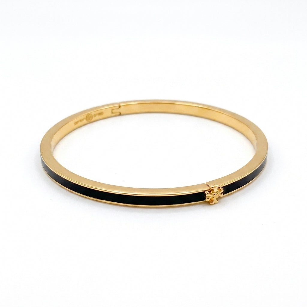 Tory Burch Icon Thin Enamel Bracelet in gold-tone with black enamel inlay and iconic Double T logo