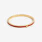 Tory Burch Icon Thin Enamel Bracelet in gold-tone with red enamel inlay and iconic Double T logo
