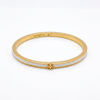 Tory Burch Icon Thin Enamel Bracelet in gold-tone with white enamel inlay and iconic Double T logo