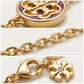 Detailed shot of the adjustable lobster clasp and the gold brand tag on the Kira Flower Bracelet