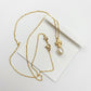 Tory Burch Kira Pearl Pendant Necklace in gold-tone featuring a Chevron-patterned Double T logo