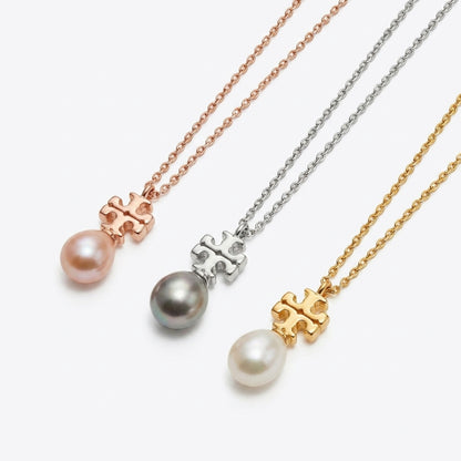 Three pearl necklaces with different colored chains on a white background