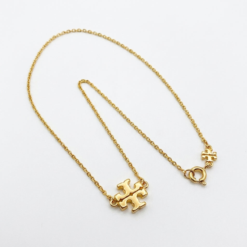 Tory Burch Kira Gold Pendant Necklace in 18k gold-plated brass with Chevron pattern
