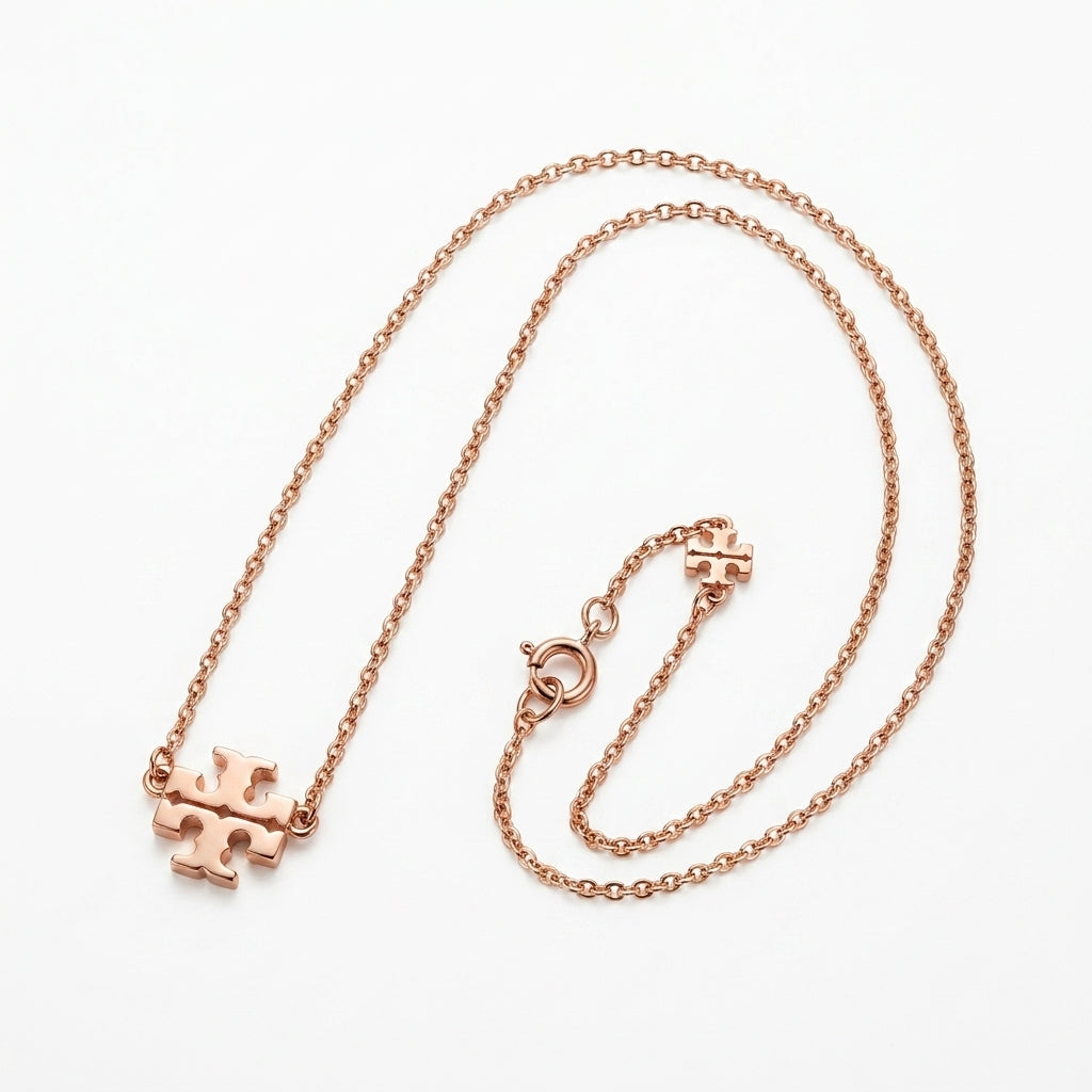 Tory Burch Kira Gold Pendant Necklace in 18k rose gold-plated brass with Chevron pattern