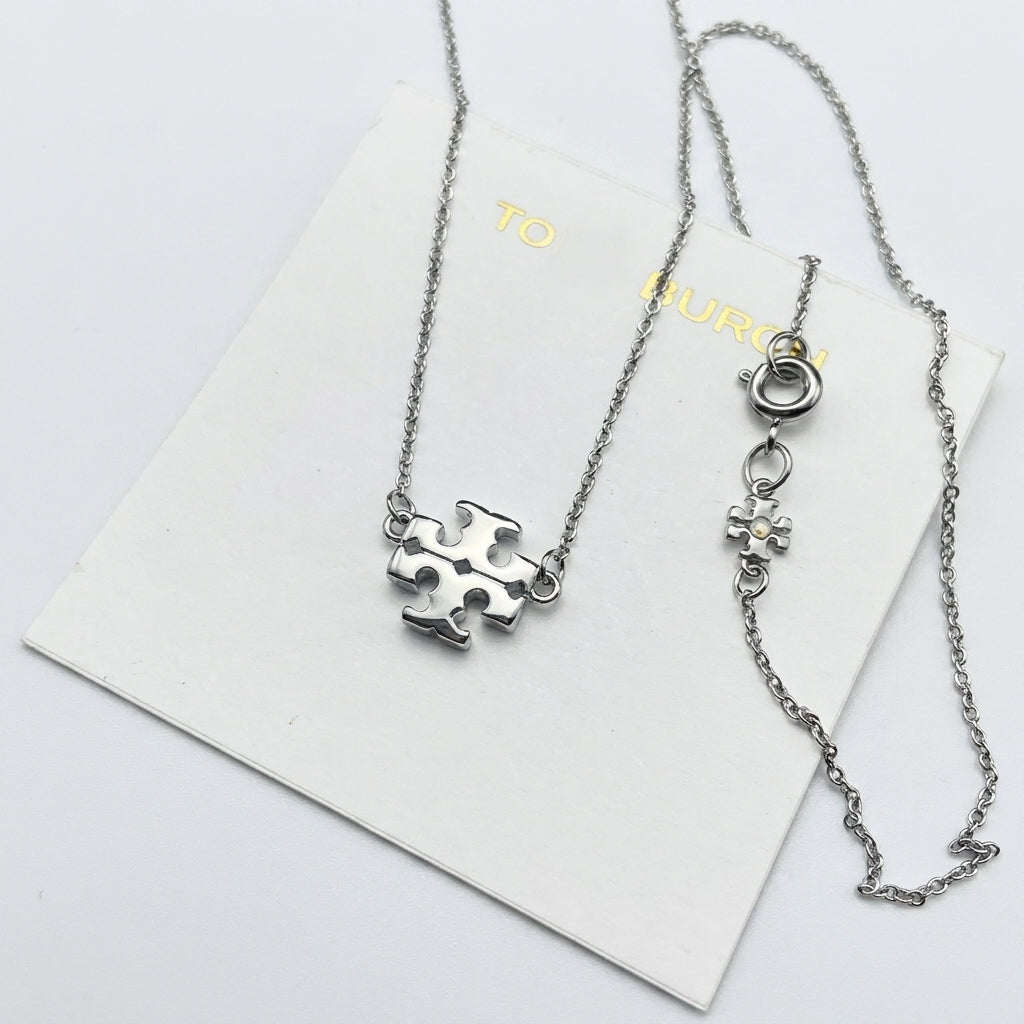 Tory Burch Kira Gold Pendant Necklace in 18k silver-plated brass with Chevron pattern