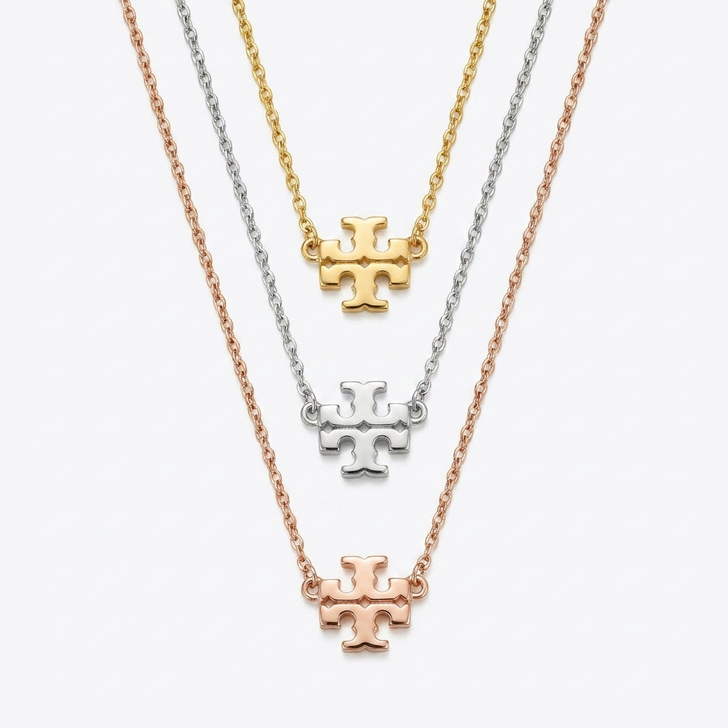 Tory Burch Kira Gold Pendant Necklace in 18k gold-plated brass with Chevron pattern