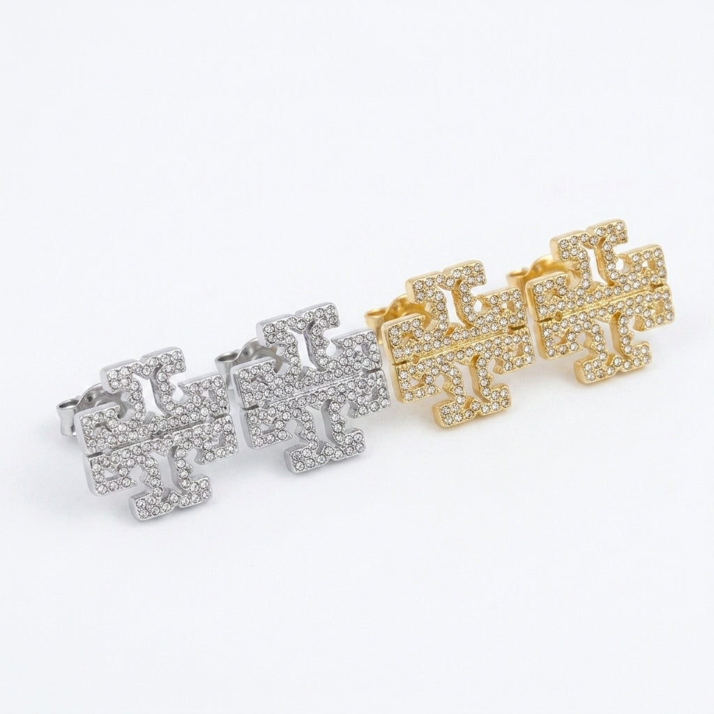 Angled shot of Kira Crystal Chevron Earrings showing the textured pavé setting and 3D profile