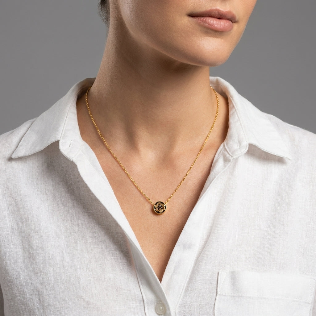 Model wearing Tory Burch Kira Flower Necklace, an elegant feminine accessory for daily luxury