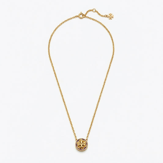 Tory Burch Kira Flower Pendant Necklace in 18k gold-plated brass with Mother of Pearl and Chevron logo