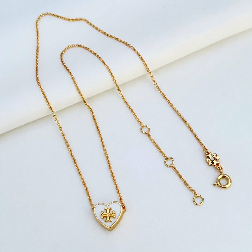 Tory Burch Kira Heart Pendant Necklace in 18k gold-plated brass featuring Double T logo
