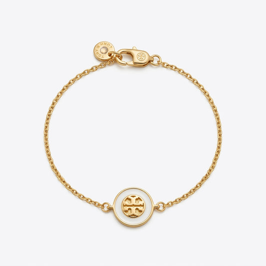 Studio shot of the Tory Burch Kira Enamel Chain Bracelet on a pure white background, highlighting the iconic double T logo