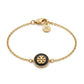 High-resolution product image of the Kira Enamel Chain Bracelet on a white background, showing the gold-tone finish and logo.