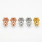 Macro detail of the precision pavé setting and secure butterfly back on Tory Burch Kira T earrings