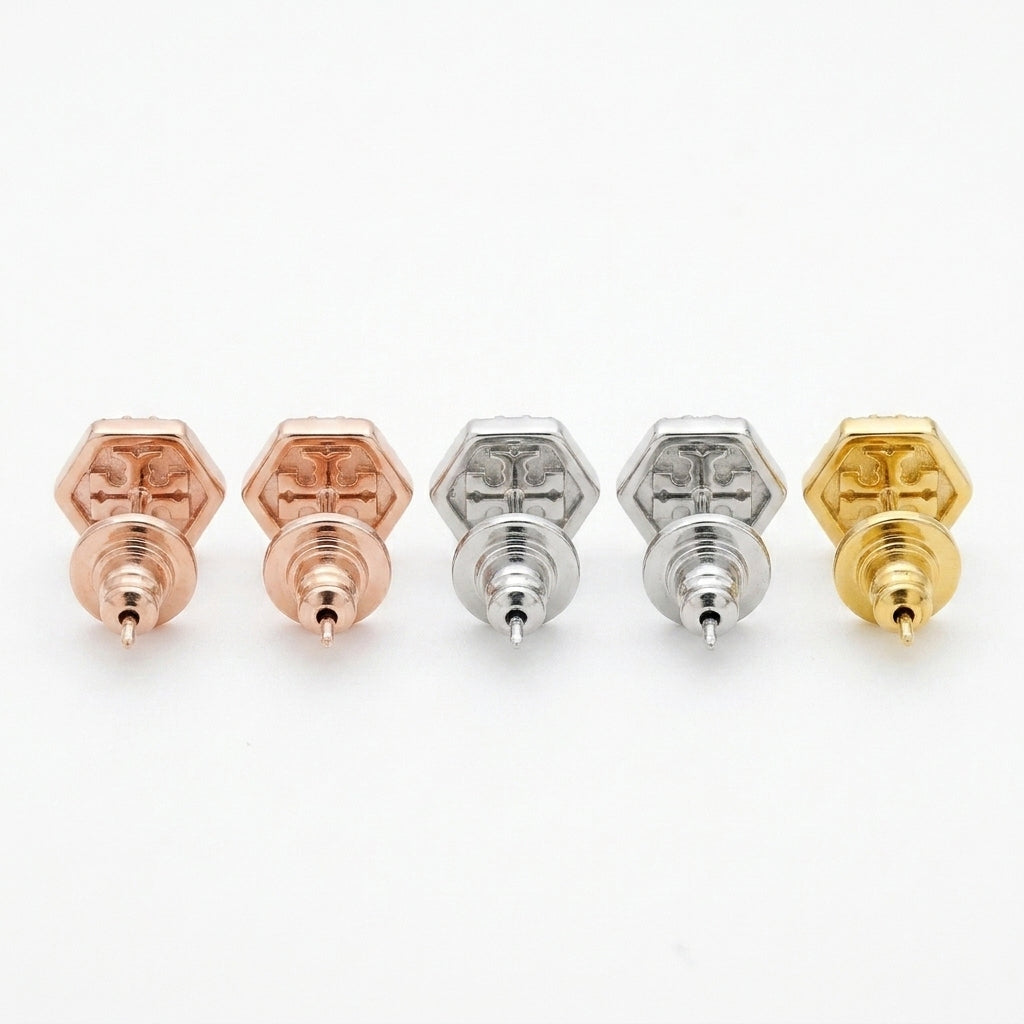 Macro detail of the precision pavé setting and secure butterfly back on Tory Burch Kira T earrings
