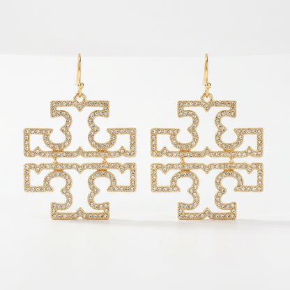 A pair of Tory Burch large Double T logo statement earrings in 18k gold plated brass, featuring openwork pave crystal accents.