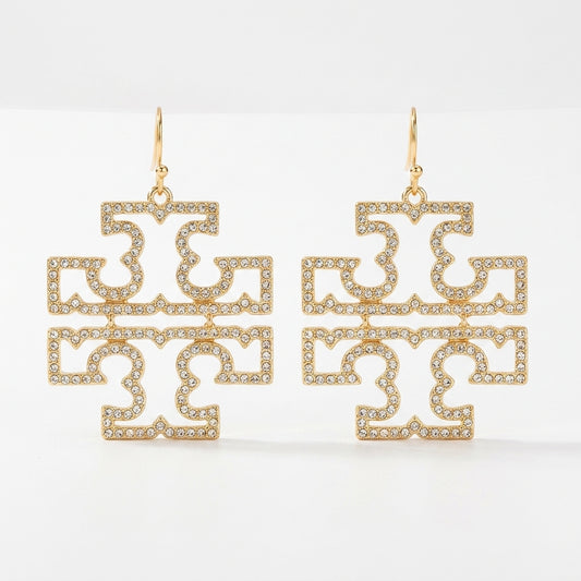 A pair of Tory Burch large Double T logo statement earrings in 18k gold plated brass, featuring openwork pave crystal accents.