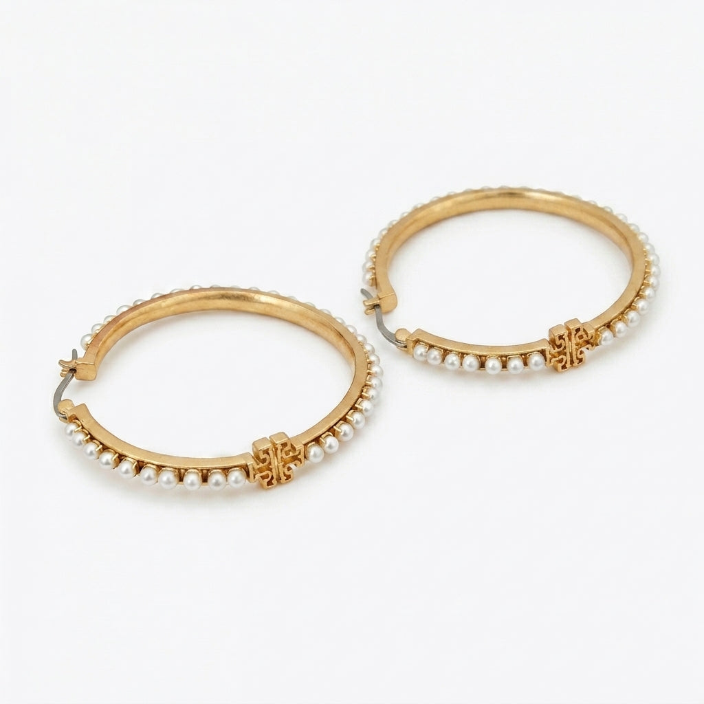 Tory Burch Logo Pearl Hoop Earrings featuring a Double T icon and lustrous pearl drop in 18k gold finish