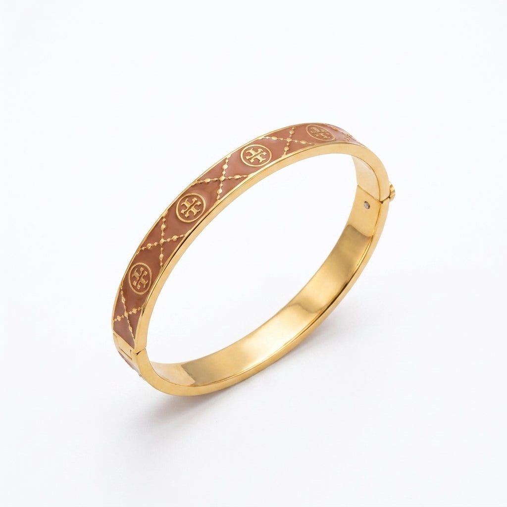 Tory Burch Miller Enamel Logo Hinge Bracelet in gold-tone with vibrant enamel inlay and cutout Double T