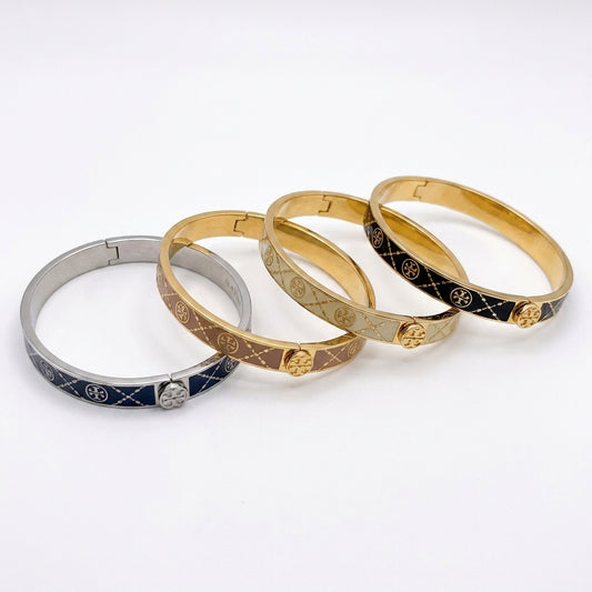 Tory Burch Miller Enamel Logo Hinge Bracelet in gold-tone with vibrant enamel inlay and cutout Double T