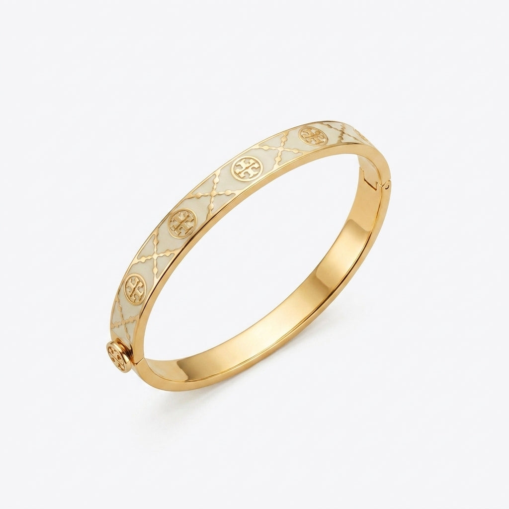 Front view of Tory Burch Miller Enamel Logo Hinge Bracelet in gold and ivory on a clean white background.