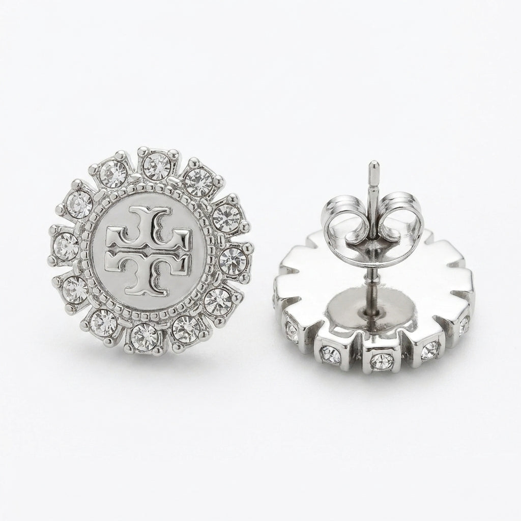 Macro detail of the high-clarity crystals and gold-tone finish on the Moondance celestial studs