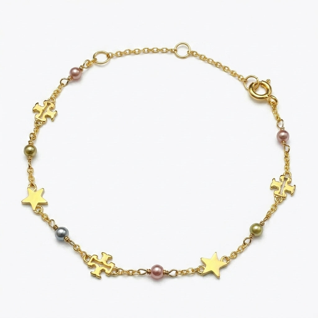 Tory Burch Moondance Pearl Bracelet featuring a delicate gold chain and high-luster pearls