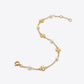 Tory Burch Moondance Pearl Bracelet featuring a delicate gold chain and high-luster pearls