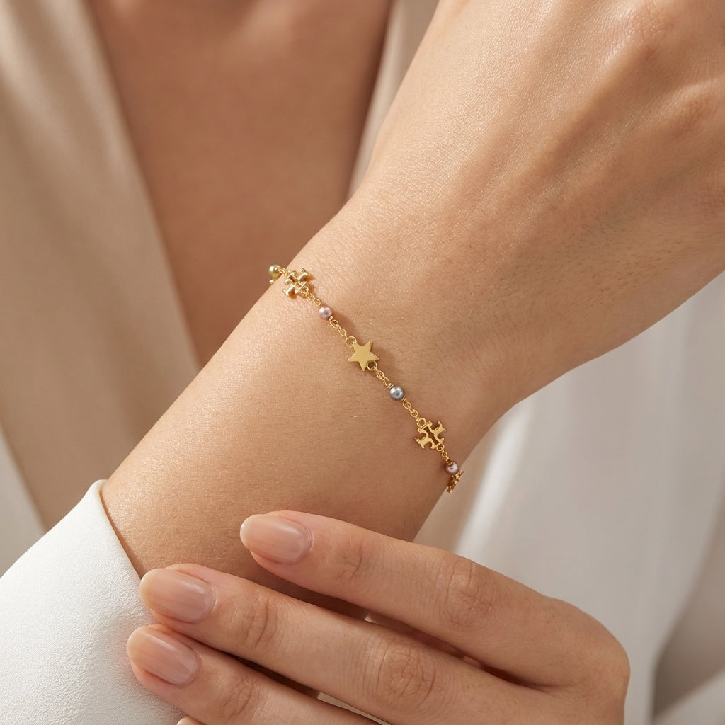 Model wearing Tory Burch Moondance Pearl Bracelet, perfect for a chic minimalist daily look