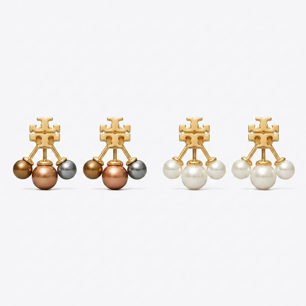 Tory Burch Moondance Pearl Front-Back Earrings in gold finish with celestial star and moon motifs