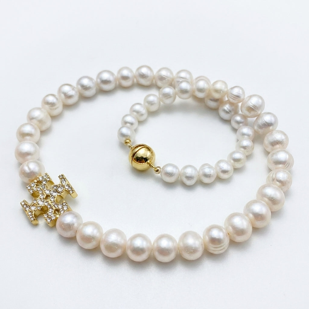 Tory Burch Moondance Pearl Necklace in gold-tone with high-luster celestial pearls