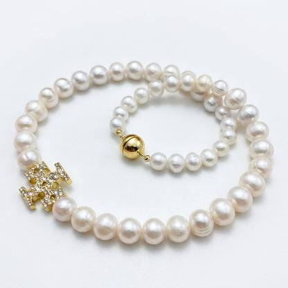 Tory Burch Moondance Pearl Necklace in gold-tone with high-luster celestial pearls