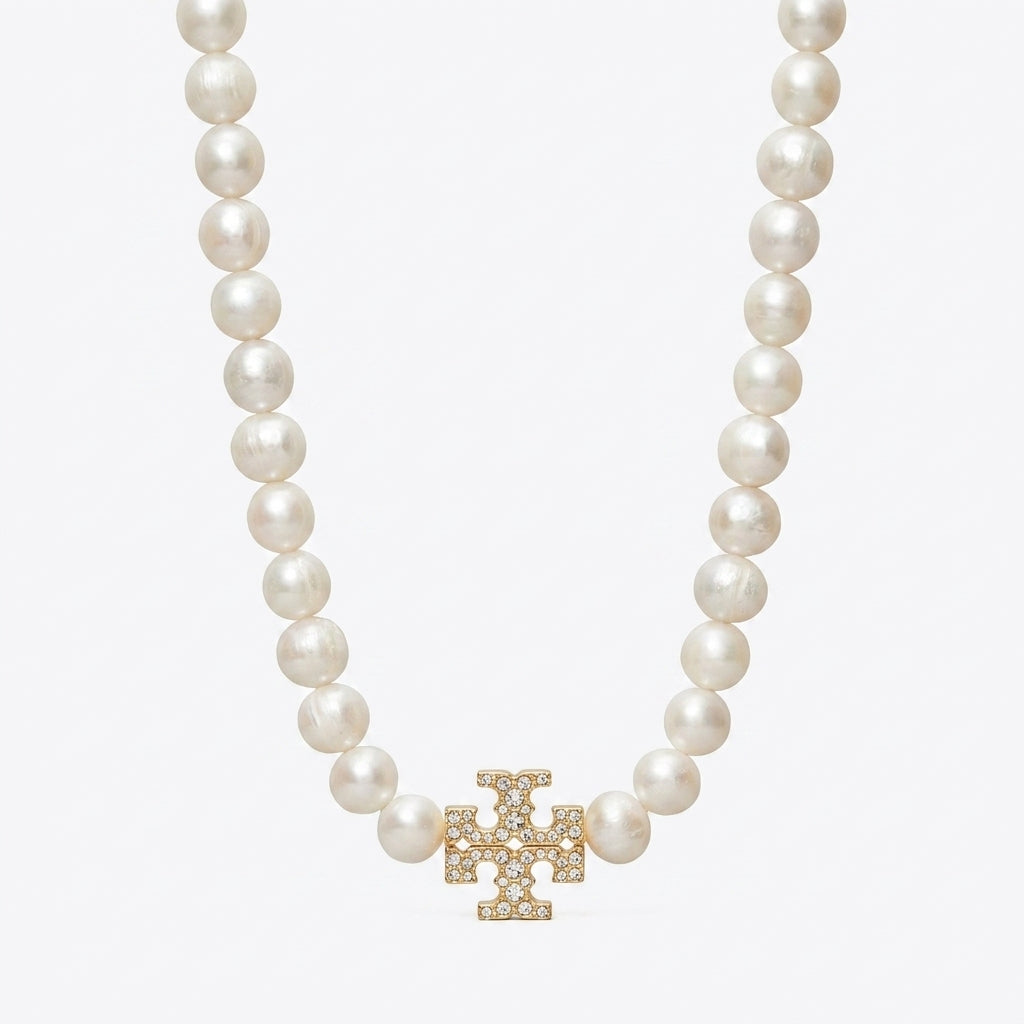 Tory Burch Moondance Pearl Necklace in gold-tone with high-luster celestial pearls