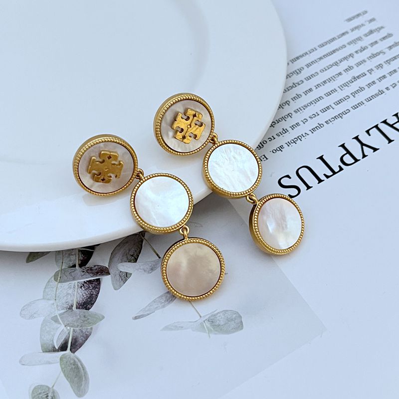 Tory Burch mother of pearl gold logo drop earrings front view oval pearl drop double-T