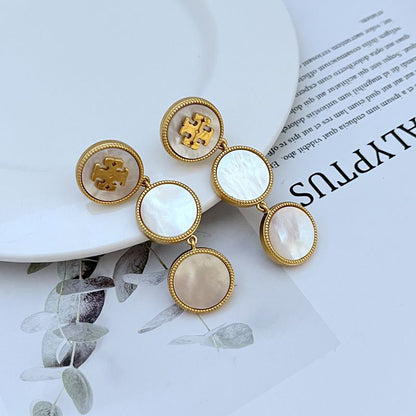 Tory Burch mother of pearl gold logo drop earrings front view oval pearl drop double-T