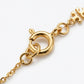 Detailed view of the lobster clasp and adjustable extender on the gold Kira pearl necklace