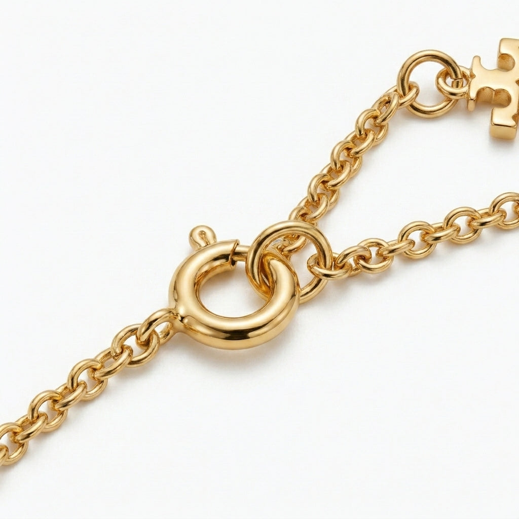 Detailed shot of the secure lobster clasp and adjustable extender on the gold flower necklace